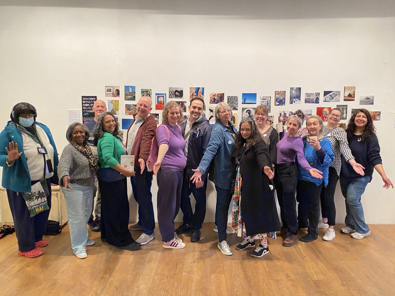 Participants at Four Corners Gallery playing the creative health card game in front of 7 years of workshop photographs — Mindful Photo Lab ELF Festival of Creative Health