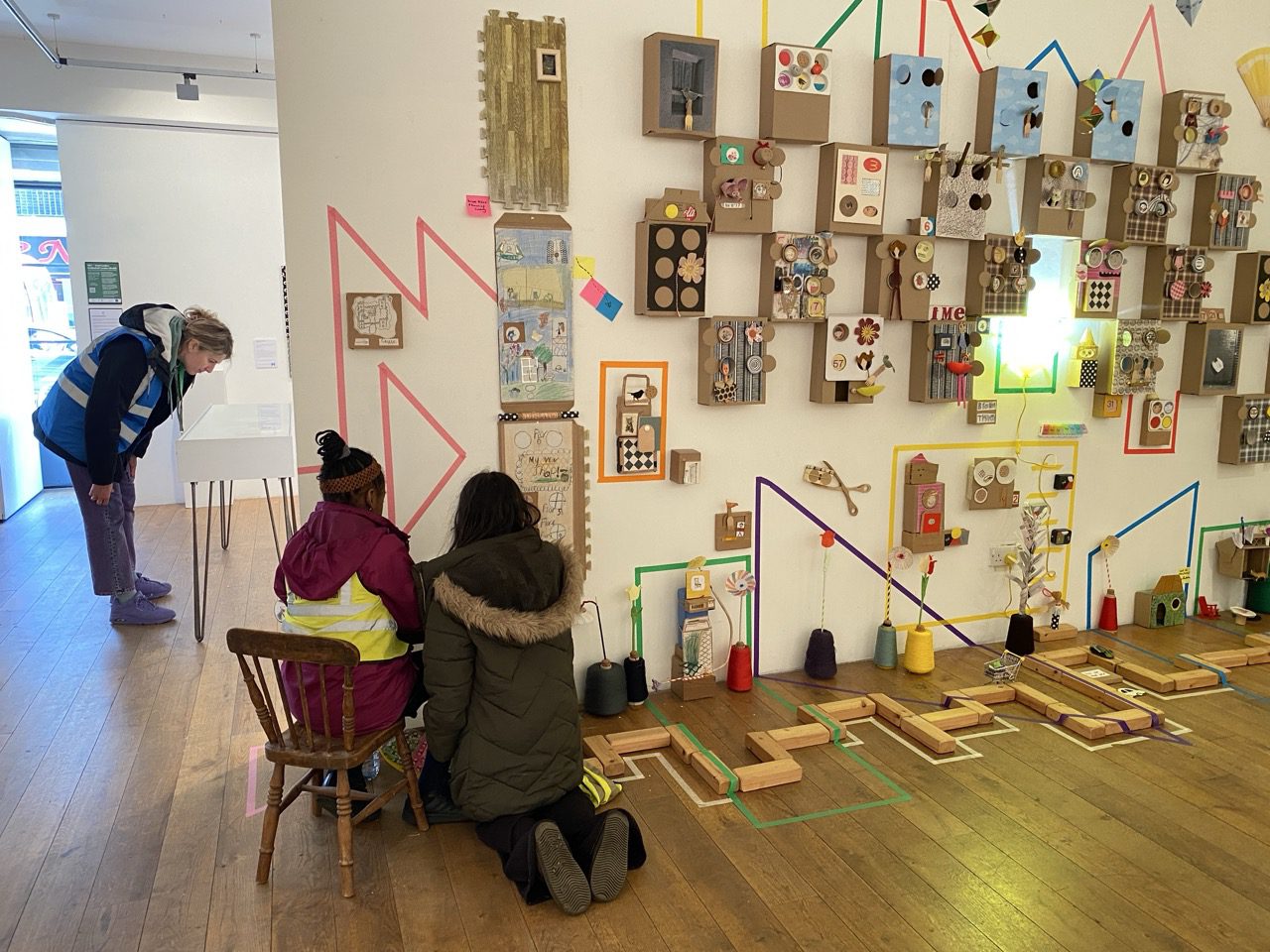 Children from Bethnal Green After School Club visiting the exhibition they helped create, Four Corners, May 2026.