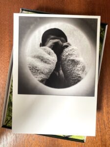 Close-up image of illustrated game cards from the Creative Health Photo Game on the booth table